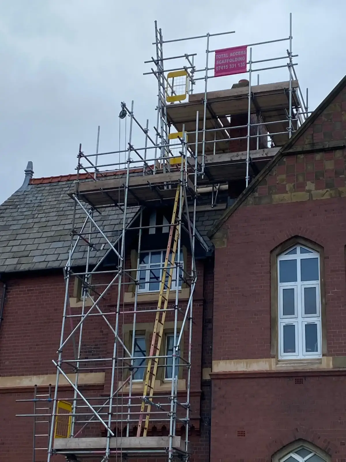 Full scaffolding access on detached property with safety netting in Cumbria