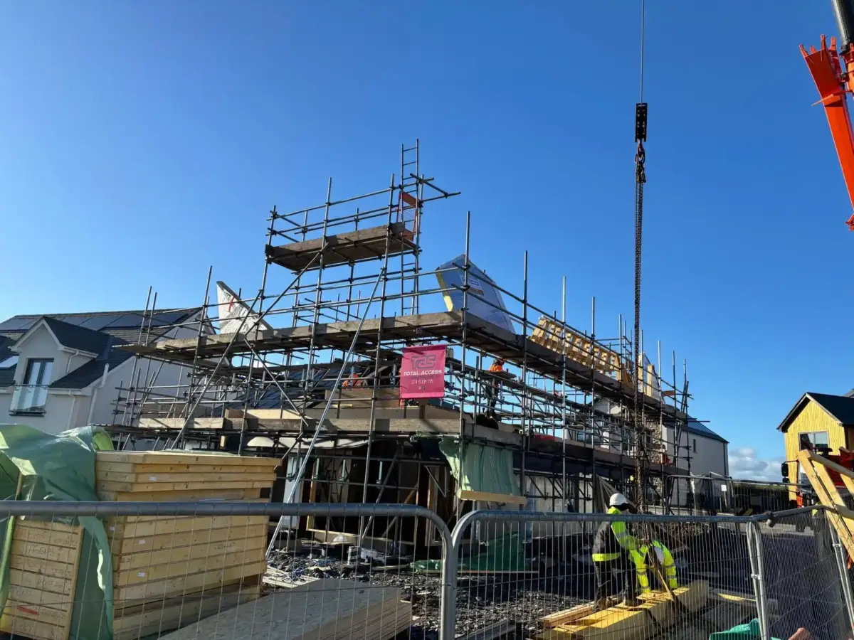 Scaffolding on new build timber frame house under construction at Wellbank, Bootle