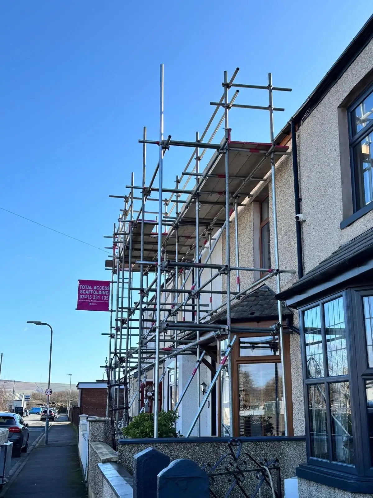 Scaffold tower providing safe working platform for window repairs in Millom