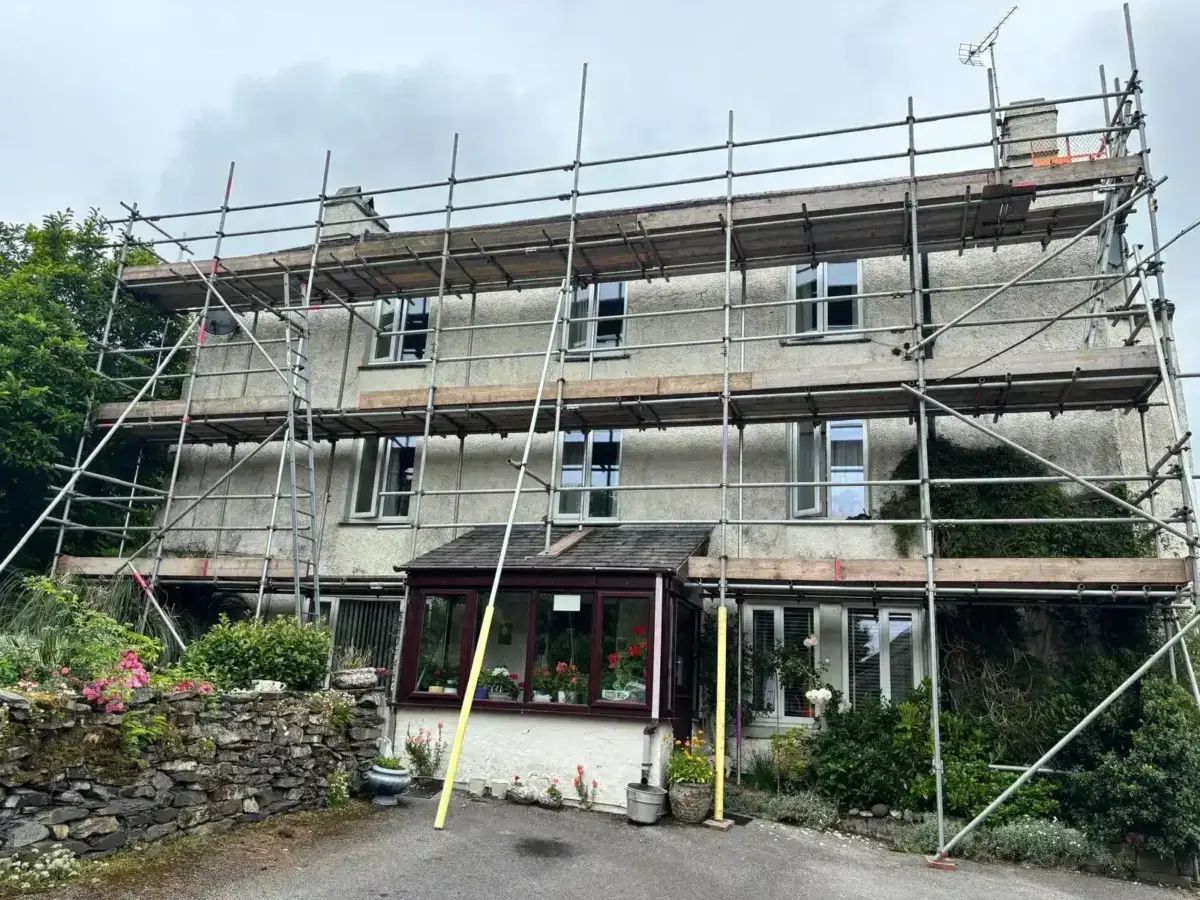 Independent scaffolding tower for external redecoration on house in Cumbria