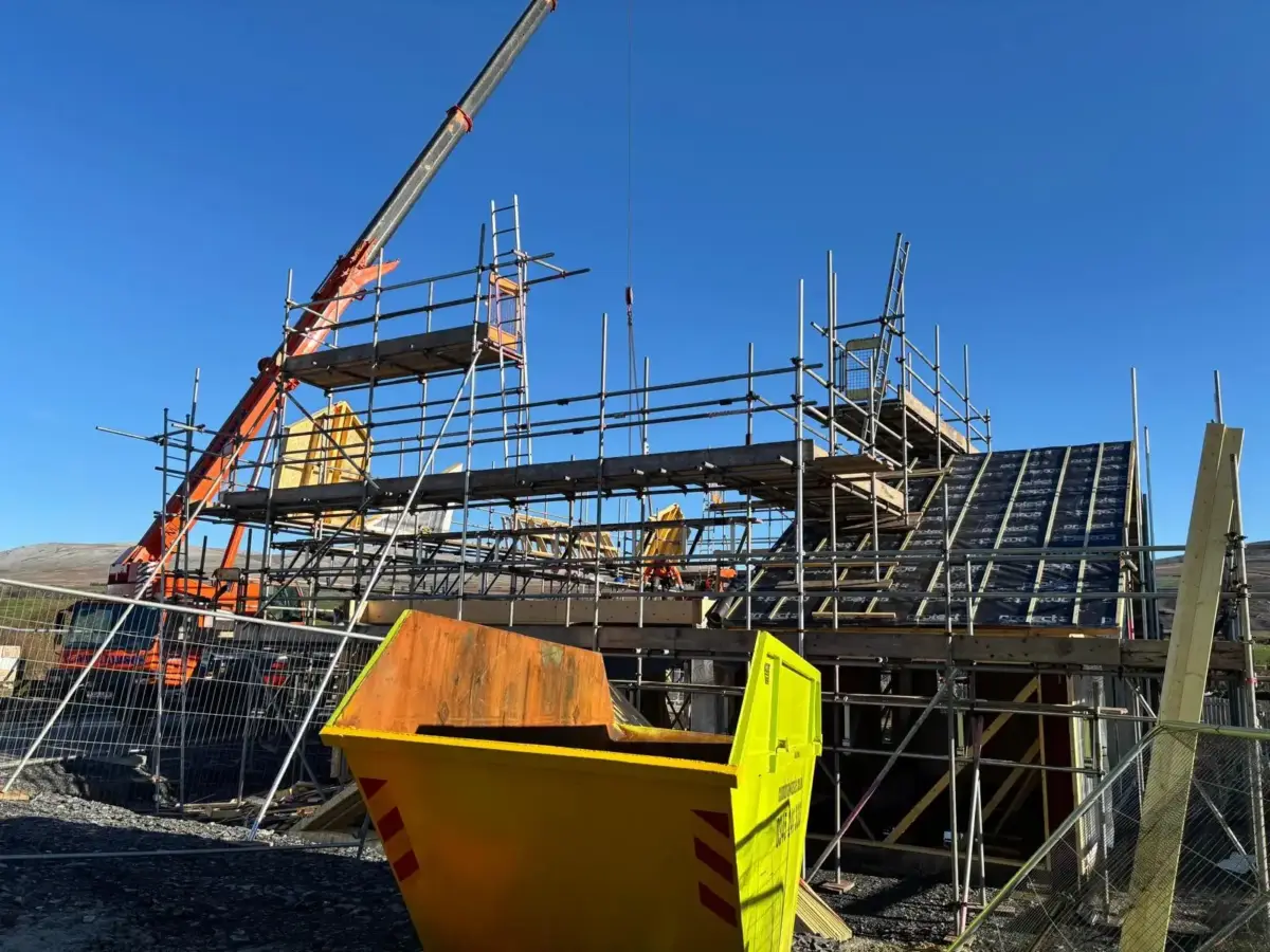 New build scaffolding with safe working platforms for bricklaying at Wellbank