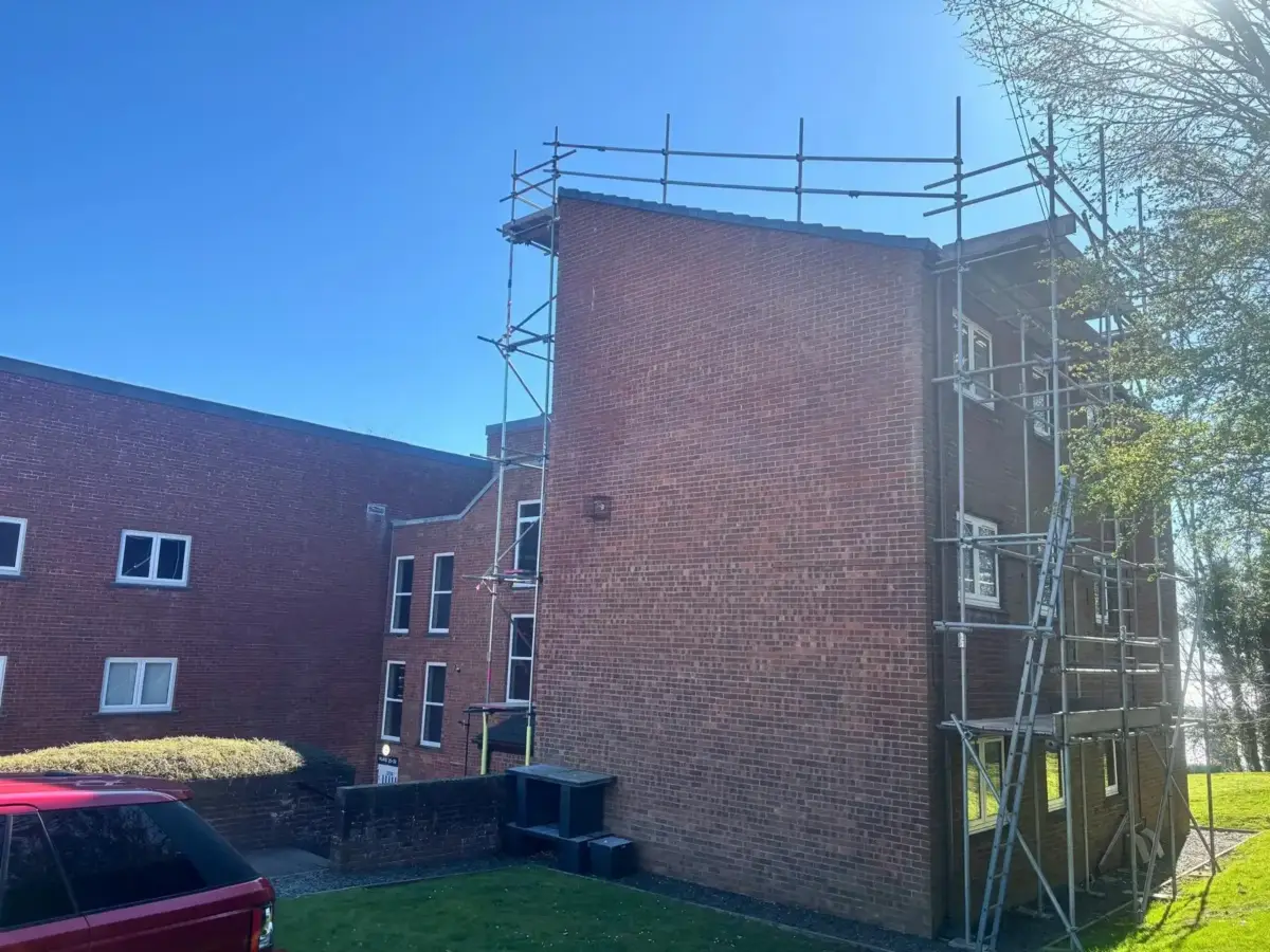 Scaffold tower providing independent access for render work on house in Walney