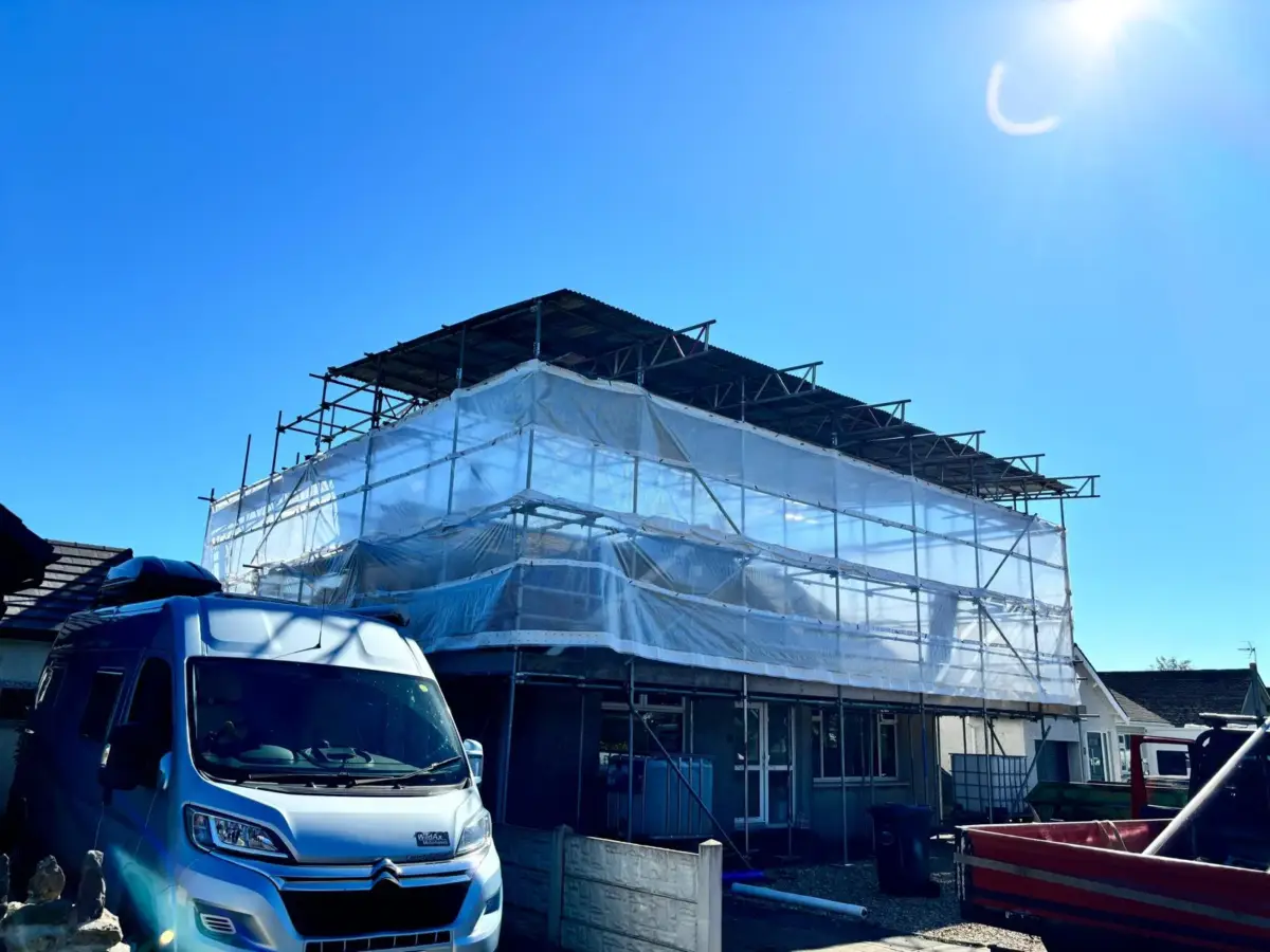 Scaffold canopy roof sheeting installation for weather protection