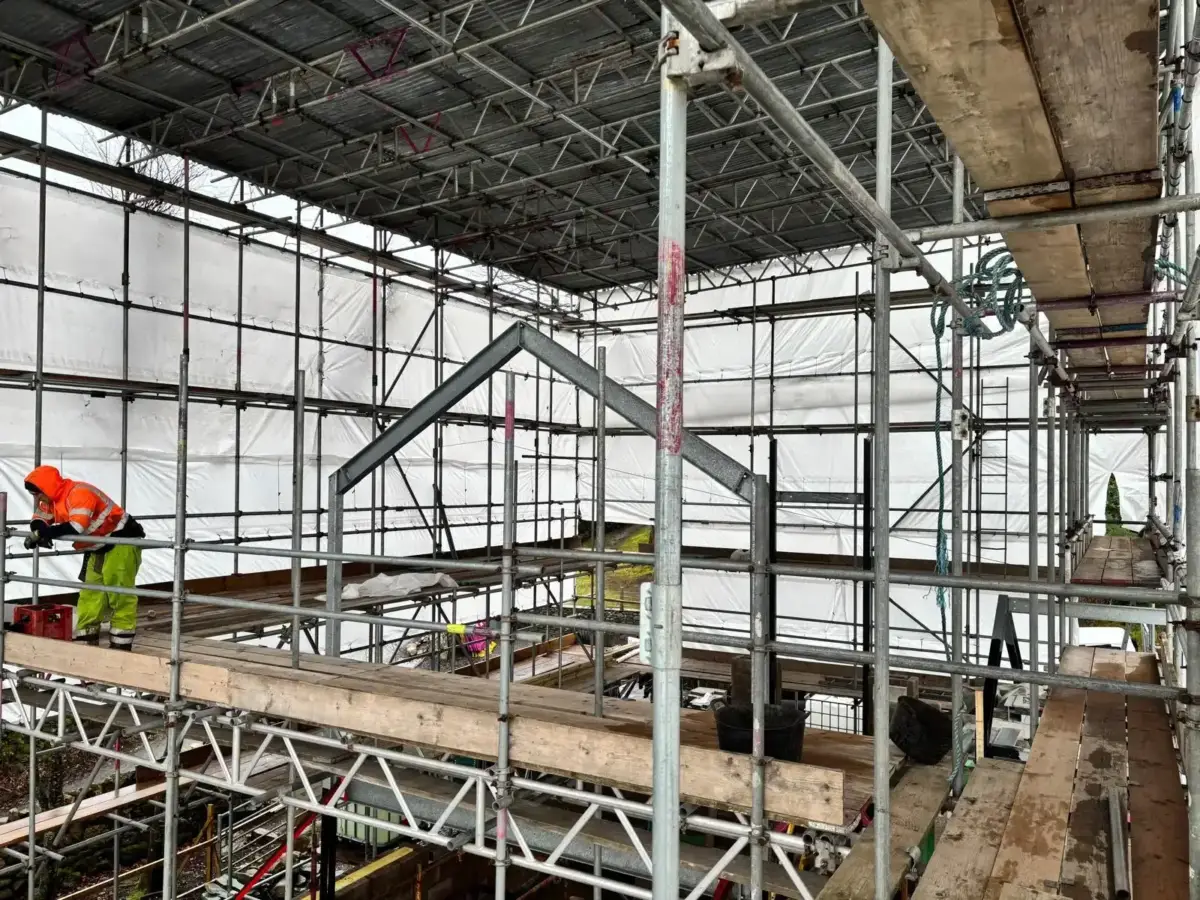 Scaffold canopy tent structure covering work area in Broughton Mills